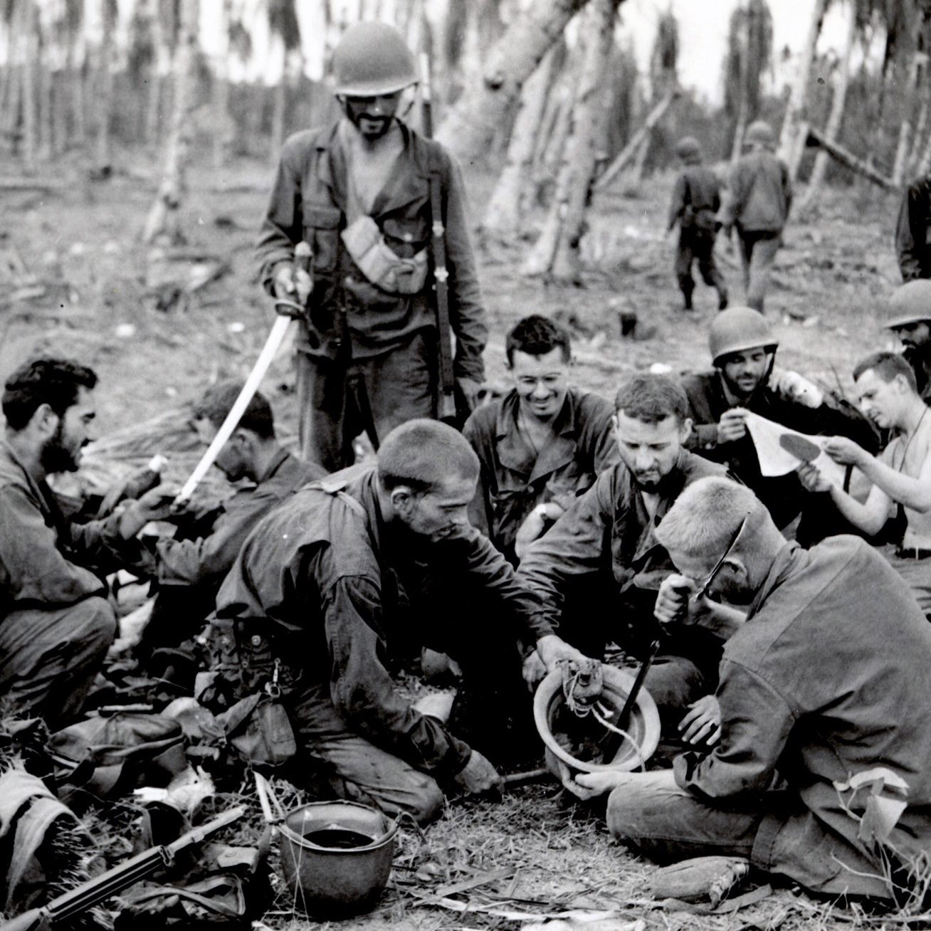 WWII Soldiers in Pacific Theater reviewing souvenirs